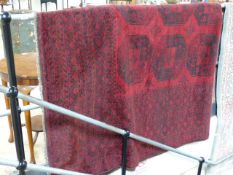 Large Wine Red ground rug with all over design. Vendor brought at Libertys but no receipt