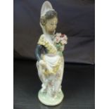 Lladro figure of an Oriental girl holding a spray of flowers. 1 Flower head has been replaced