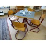 Retro French table and four chairs in wood and burgendy coloured metal by Souvignet Plichaise