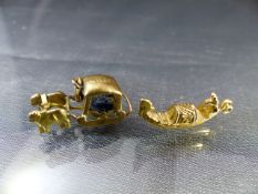 Two Gold Charms - (1) Stamped 'Portugal and Masira in the form of a covered sled pulled by two Ox