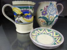 Small Poole Pottery Collection - two jugs and a Pin dish. (1) Bulbous red bodied jug decorated in