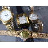 Four gold coloured dress watches, one stamped A1 to side.