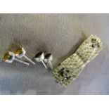 Paste set brooch which comes apart to make earrings and two pairs of earrings set with 1) yellow