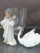 Three Lladro figures - to include Baby in a manger, Bundled Bather, Male swan and a boxed Durand