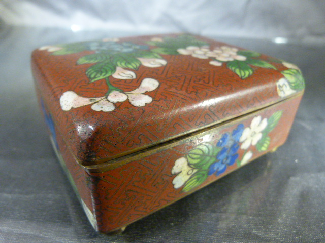 Antique cloisonne box on Red Ground decorated with pink scroll flowers. Turquoise ground inside on