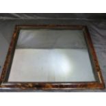 An Early Tortoise shell on wood wall mirror. The Rectangular frame houses a relatively chunky