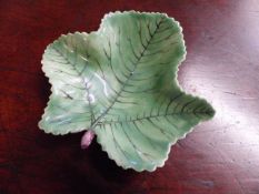 A very rare Bow pickle leaf dish hand painted in vibrant polychrome green with purple stalk c.1758