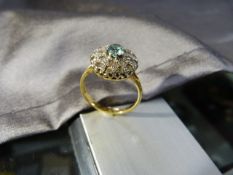 18ct Gold zircon Ring, Central natural blue zircon surrounded by 20 small clear Zircons set in two