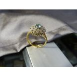 18ct Gold zircon Ring, Central natural blue zircon surrounded by 20 small clear Zircons set in two