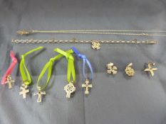 Ten 9ct pendants (mostly crosses with small stones) and a fine necklace and a bracelet.