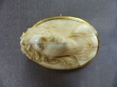 A Victorian carved ivory cameo of a female bust, in yellow metal mount stamped '9ct.' &