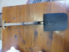 Early Military folding spade and pick axe combination terminating in an oak handle