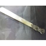 Good Quality victorian letter opener with Mother of Pearl blade and silver hallmarked handle.