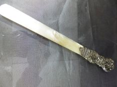 Good Quality victorian letter opener with Mother of Pearl blade and silver hallmarked handle.