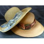 Two Mulberry England vintage straw, wide-brimmed summer hats. One decorated with a large fabric blue