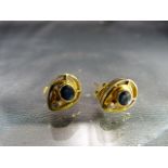 Pair of 18ct Gold earrings set with a single sapphire and Diamond -
