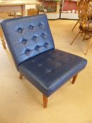 Barcelona style blue button back chair on wooden legs