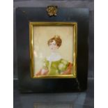 Miniature portrait of a lady on Ivory in oil. c. early 19th century in a black frame