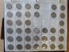 Collecta coin case with 8 sleeves all of which are nearly full. Mainly containing English and