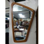 1970's Danish Teak wood wall mirror of shaped form having Denmark impressed to verso.