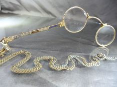 Gold coloured pair of spring loaded Pince-Nez with blue enamel decoration and hung on base metal
