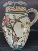 Honiton Pottery - Large and unusual coloured Collard Honiton Pottery jug, with slip handle. Marked