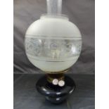 Oil lamp by J Wippell & Co Exeter with chimney and shade