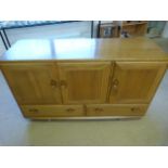 Ercol Blonde elm side board with three cupboards over two drawers