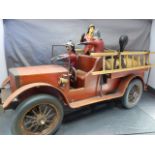 Large antique wooden and metal fire engine, rubber wheels. Two vintage wooden ladders. Three fireman