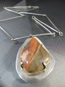 Silver (Birmingham 1978) contemporary pendant and chain by JRJ. The Pendant is set with a claw set