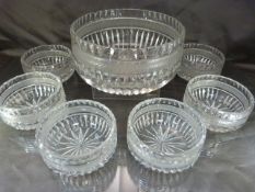 Cut glass dessert bowl with six serving bowls in the same pattern