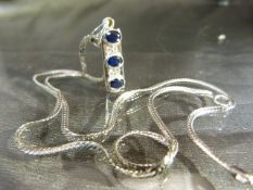 18ct white Gold chain with sapphire and Diamond hanging pendant set in 18ct white Gold. Three Oval