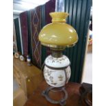 Victorian oil lamp with burner and cast iron base and blue glass well, the metal base having
