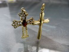 Two 9ct Gold crosses one with inset red stone (Total weight 1.8g)