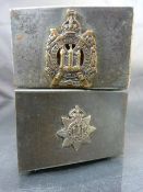 Two silver metal Military issue match box holder - 1 with plaque for Devonshire Regiment and the