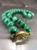 Malachite Victorian polished bead necklace with base metal clasp. Approx length - 47cm