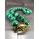 Malachite Victorian polished bead necklace with base metal clasp. Approx length - 47cm