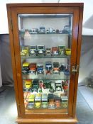 Glass fronted Display case with four glass shelves containing approx 30 mostly Matchbox toy cars