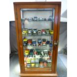 Glass fronted Display case with four glass shelves containing approx 30 mostly Matchbox toy cars