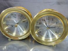 Portfolio Tiffany & Co Brass bulkheads ship clock along with a matching brass cased barometer.