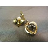 Two 14k Gold Pendants - 1 heart shaped cage with an approx 11mm Tourmilated Quartz Ball inside,