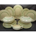Clarice Cliff Dinner service with a banded decoration and floral shape in Green. Printed mark to