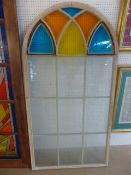 Antique pine door of arched form with stained glass panels to top and clear glass panels below