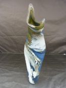 Leslie Clarke studio art glass vase of curved form decorated in marbled blue, green and white.