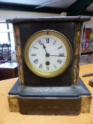 A Victorian black marble and marble inlaid cased mantle clock, with circular enamelled dial and
