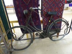 Vintage ladies road bike with lamp on front. Makers mark rubbed