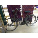 Vintage ladies road bike with lamp on front. Makers mark rubbed