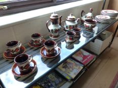 Quantity Of Schramberg German Pottery to include teapot, coffee pot, milk, plates etc