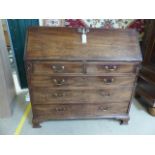 Large Antique oak Bureau with fitted shaped interior. Shaped interior drawers with brass handles.