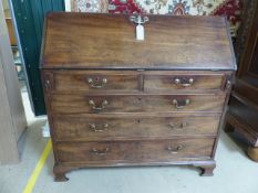 Large Antique oak Bureau with fitted shaped interior. Shaped interior drawers with brass handles.